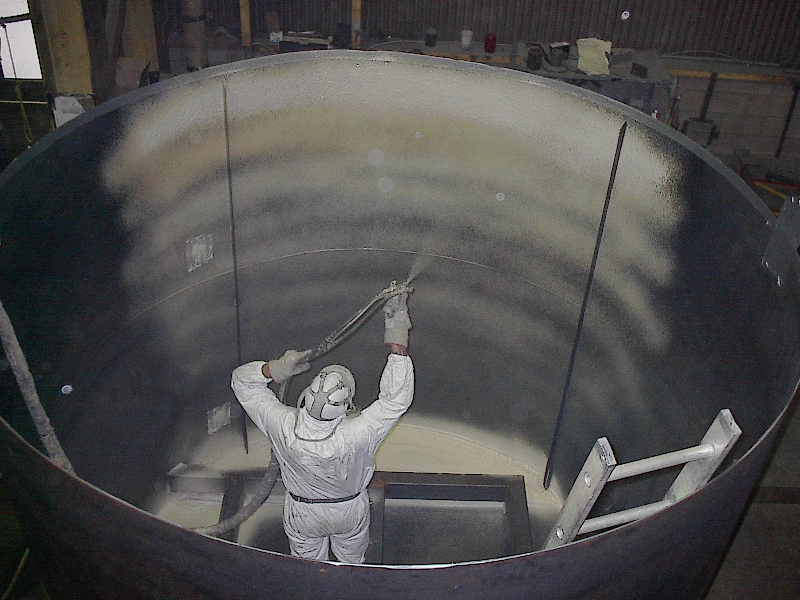 Applying foam to the inside of a tank