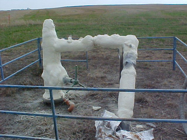 Spray foam on a wellhead